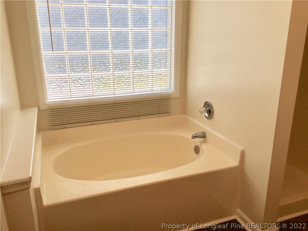 1824 Sardonyx Road, Unit 2 Fayetteville, NC 28303 - Photo 19 of 20 a bathroom with bathtub and window