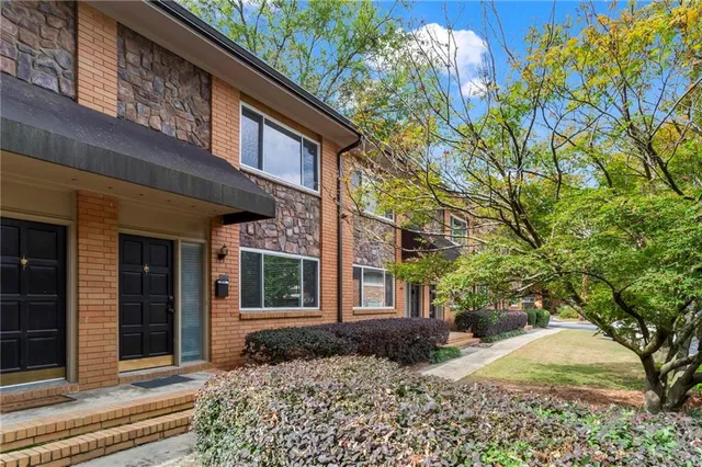 a view of a house with a tree