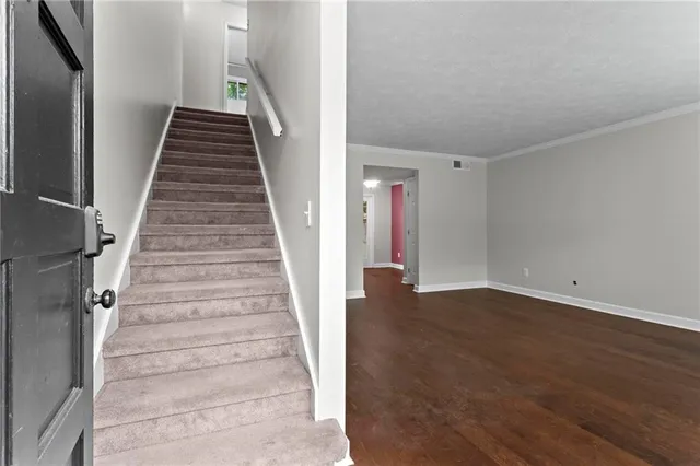 a view of entryway with wooden floor