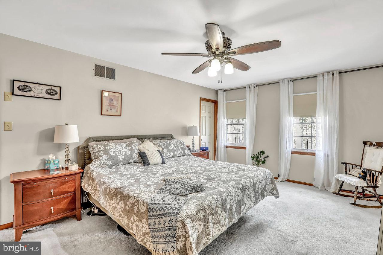 1 Washington Way Tabernacle, NJ 08088 - Photo 18 of 37 a bedroom with a bed and a chandelier