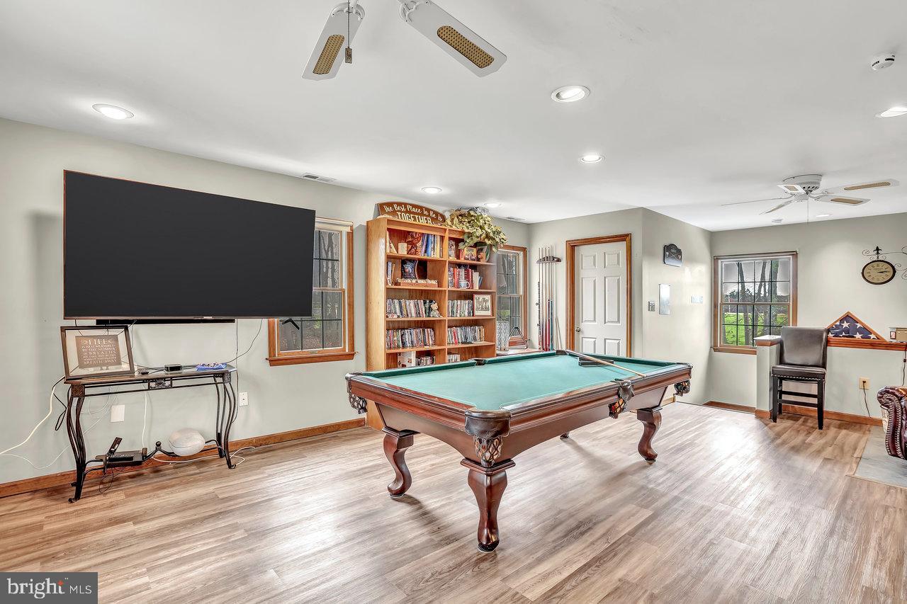 1 Washington Way Tabernacle, NJ 08088 - Photo 25 of 37 a living room with furniture a flat screen tv and gym equipment