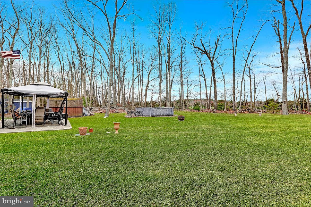 1 Washington Way Tabernacle, NJ 08088 - Photo 32 of 37 a front view of a house with a yard and trees