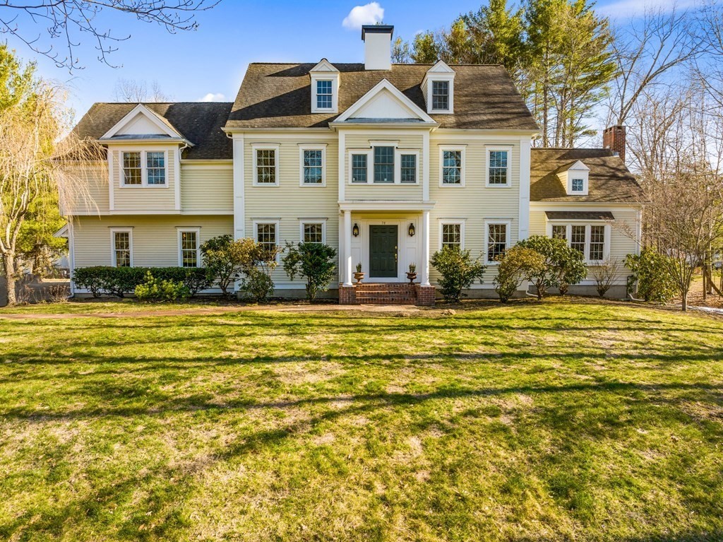 a front view of a house with a swimming pool