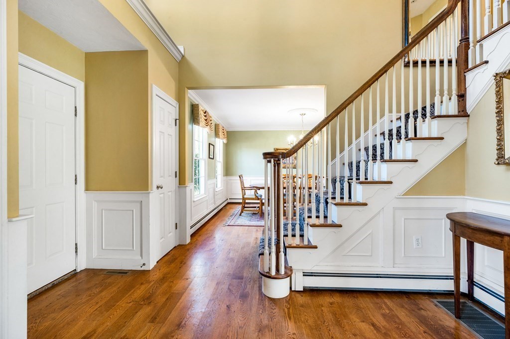 78 Paul Road Hanover, MA 02339 - Photo 11 of 42 a view of entryway with wooden floor and stairs