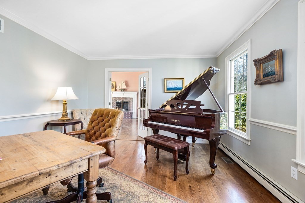 78 Paul Road Hanover, MA 02339 - Photo 13 of 42 a bedroom with furniture and a wooden floor