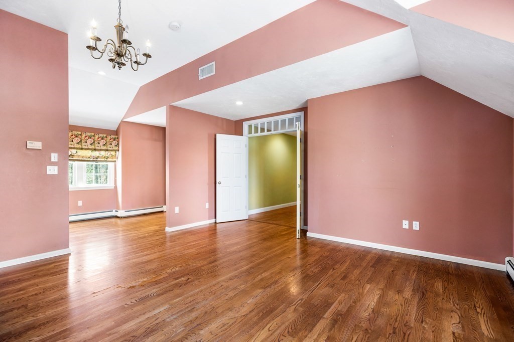 78 Paul Road Hanover, MA 02339 - Photo 18 of 42 a view of an empty room with window and wooden floor