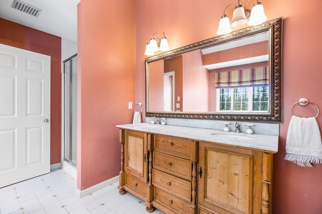 78 Paul Road Hanover, MA 02339 - Photo 22 of 42 front view of a house with a sink and a mirror