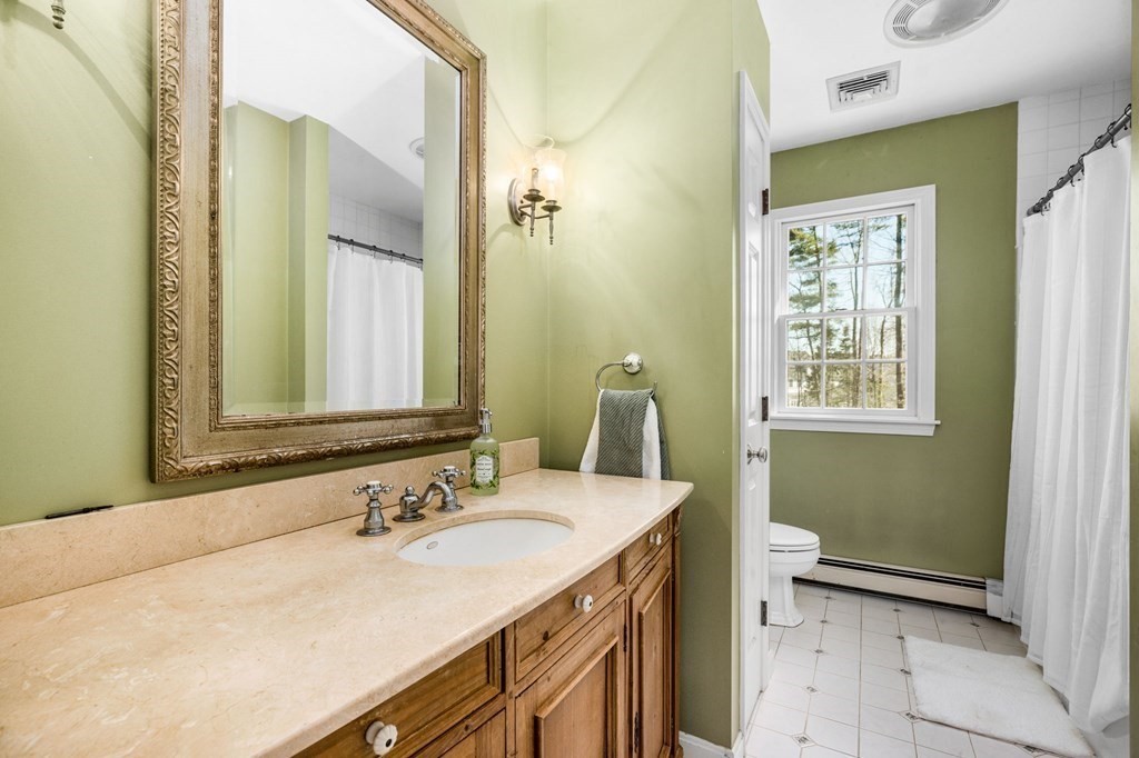 78 Paul Road Hanover, MA 02339 - Photo 25 of 42 a bathroom with a sink and a mirror