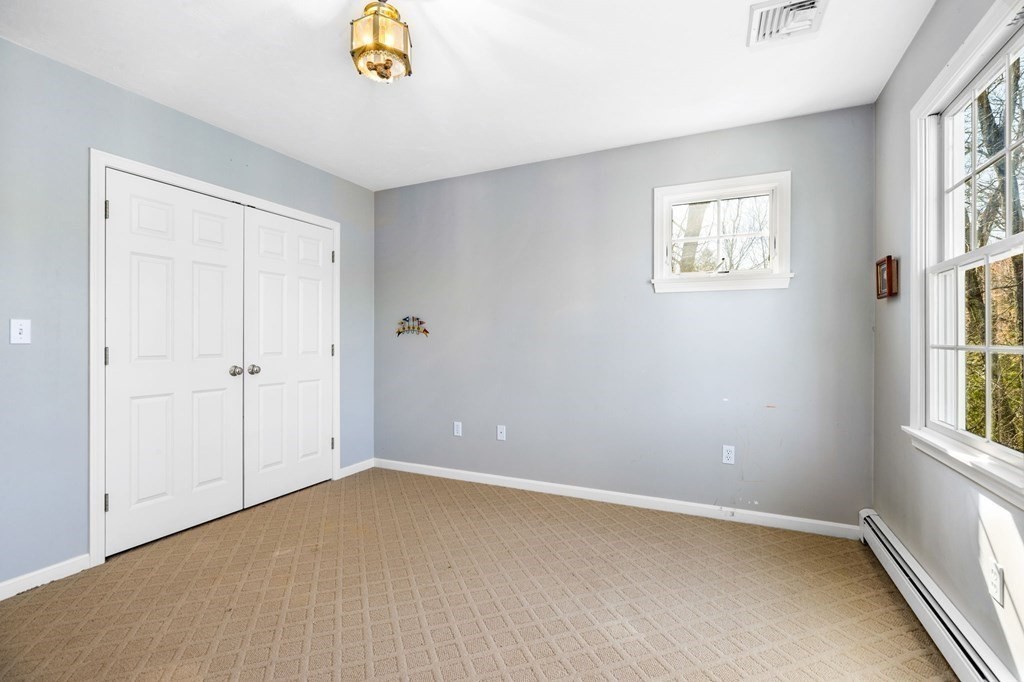 78 Paul Road Hanover, MA 02339 - Photo 26 of 42 a view of an empty room with a window