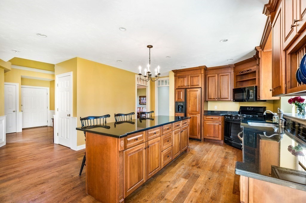 78 Paul Road Hanover, MA 02339 - Photo 4 of 42 a kitchen with stainless steel appliances granite countertop a stove and cabinets