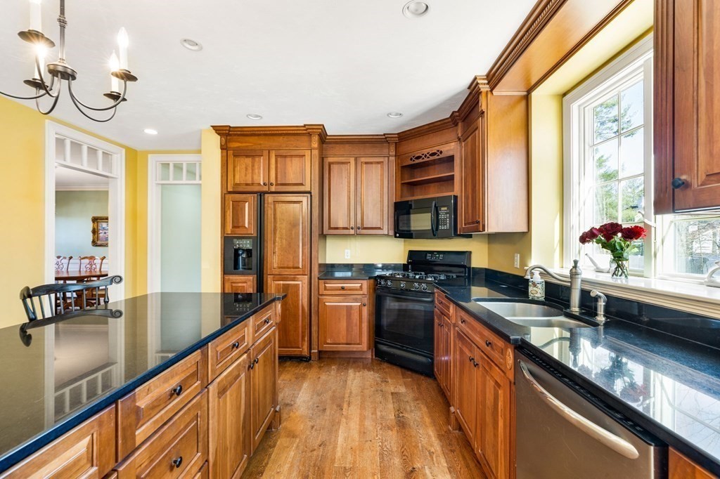 78 Paul Road Hanover, MA 02339 - Photo 5 of 42 a large kitchen with granite countertop a sink and cabinets