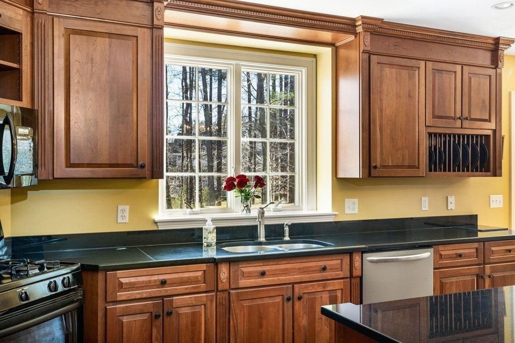 78 Paul Road Hanover, MA 02339 - Photo 6 of 42 a kitchen with stainless steel appliances granite countertop a stove and a sink