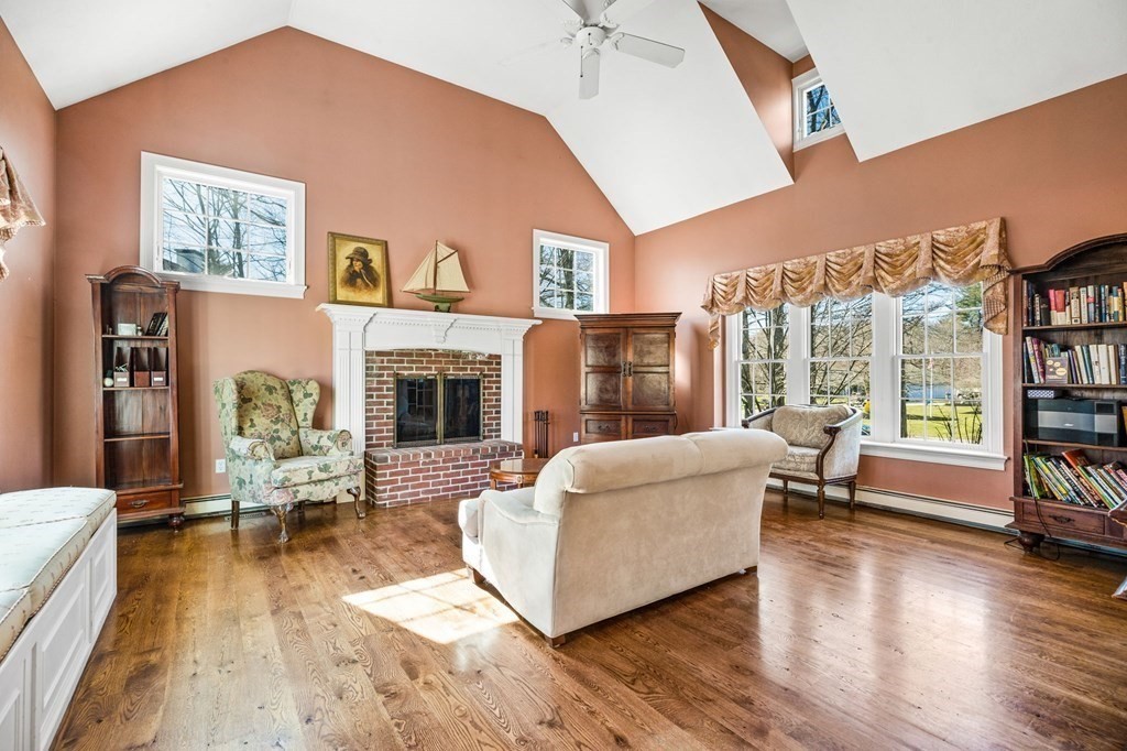 78 Paul Road Hanover, MA 02339 - Photo 10 of 42 a living room with furniture and a fireplace