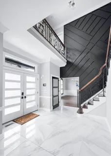 a kitchen with stainless steel appliances kitchen island granite countertop a refrigerator and a stove top oven