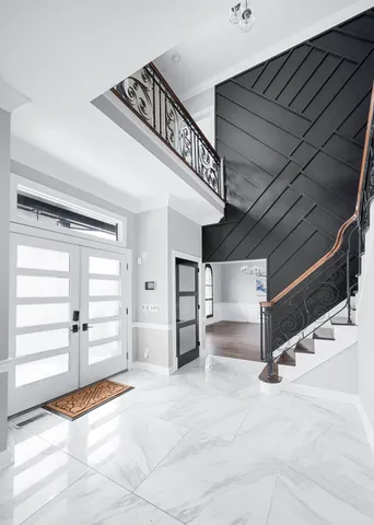 a kitchen with stainless steel appliances kitchen island granite countertop a refrigerator and a stove top oven