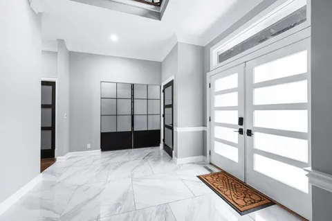 a kitchen with a sink appliances and cabinets