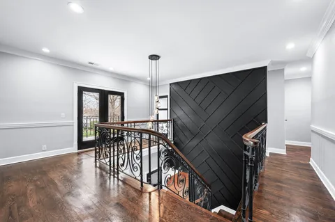 a bathroom with a granite countertop sink toilet and mirror