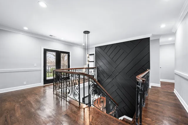 a bathroom with a granite countertop sink toilet and mirror