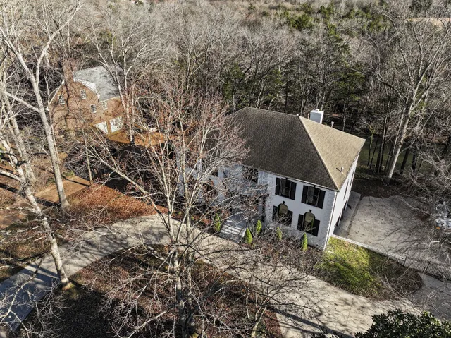a living room with a fireplace and a table