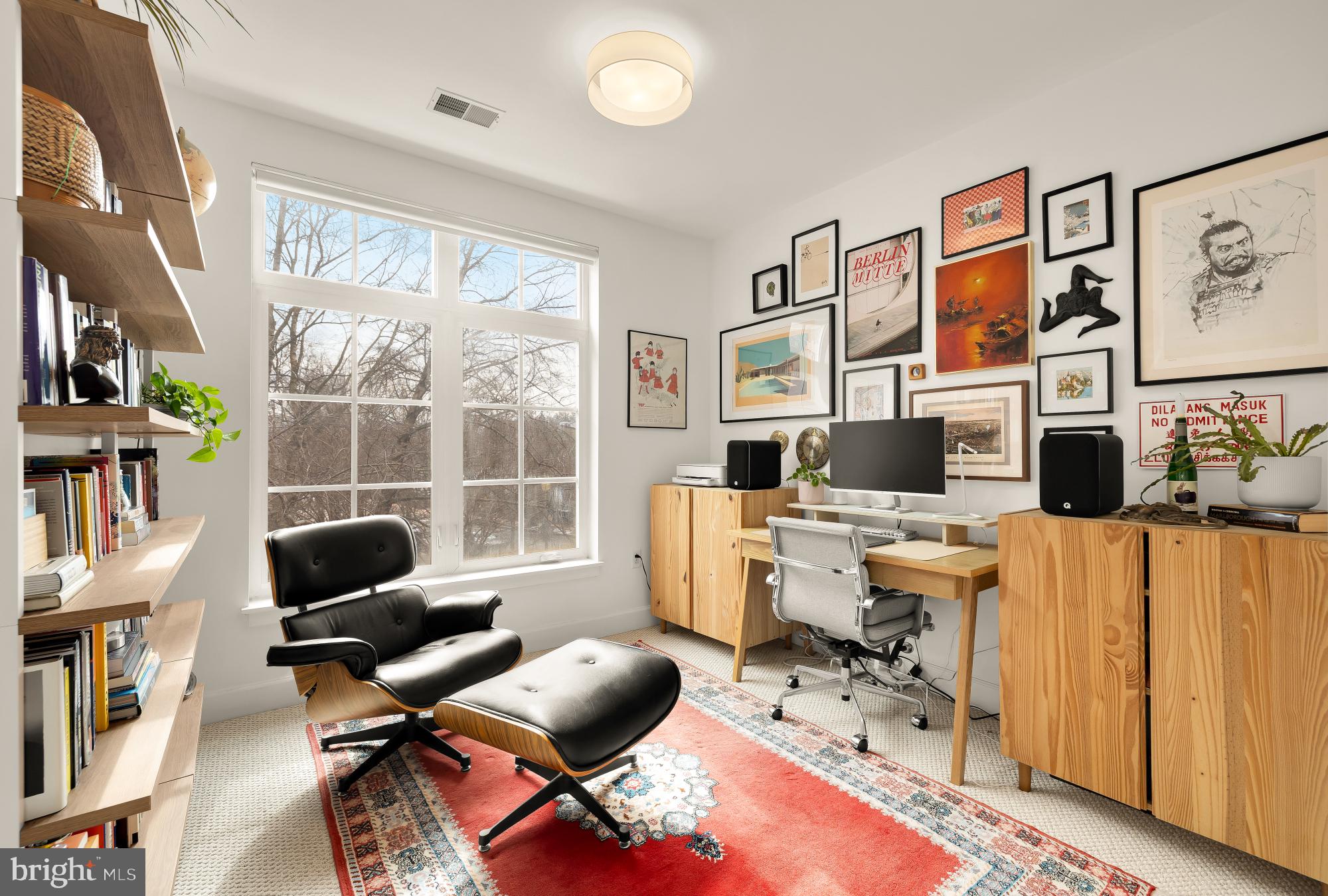 150 V Street Northwest, Unit V204 Washington, DC 20001 - Photo 18 of 26 a living room with furniture a rug and a window