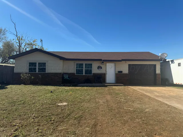 a house with yard in front of it