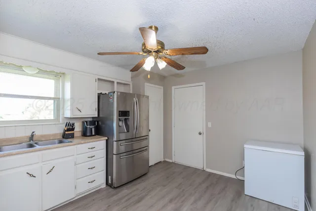 a kitchen with stainless steel appliances a refrigerator and a stove