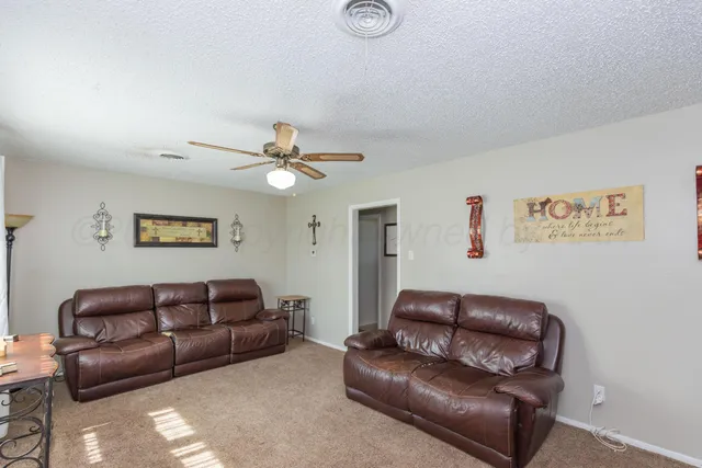 a living room with couches and furniture