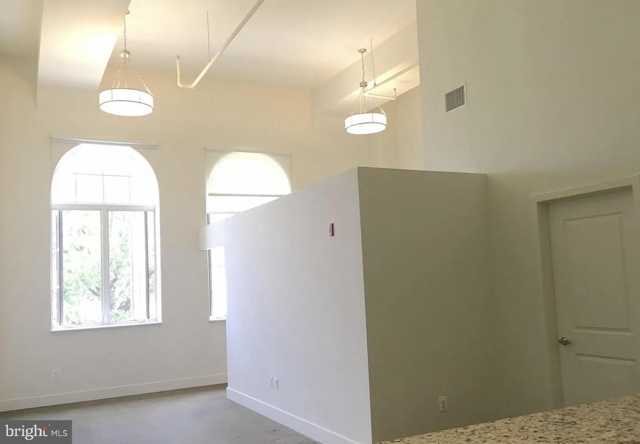 300 Cathedral Street, Unit 106 Baltimore, MD 21201 - Photo 8 of 16 a view of a livingroom with a window