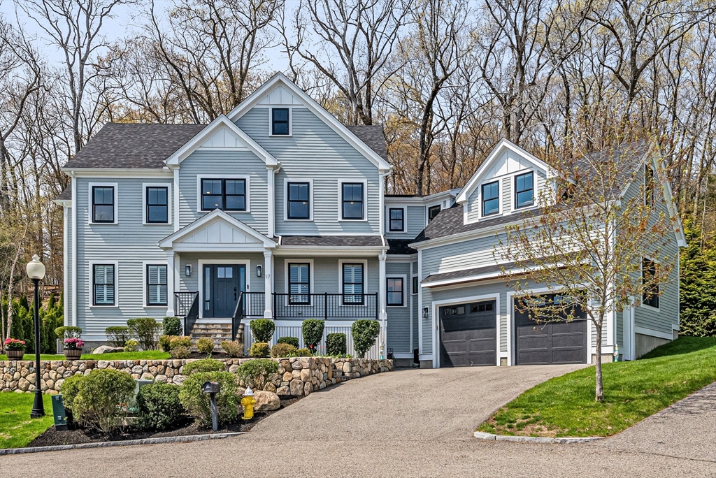 a front view of a house with yard porch and furniture