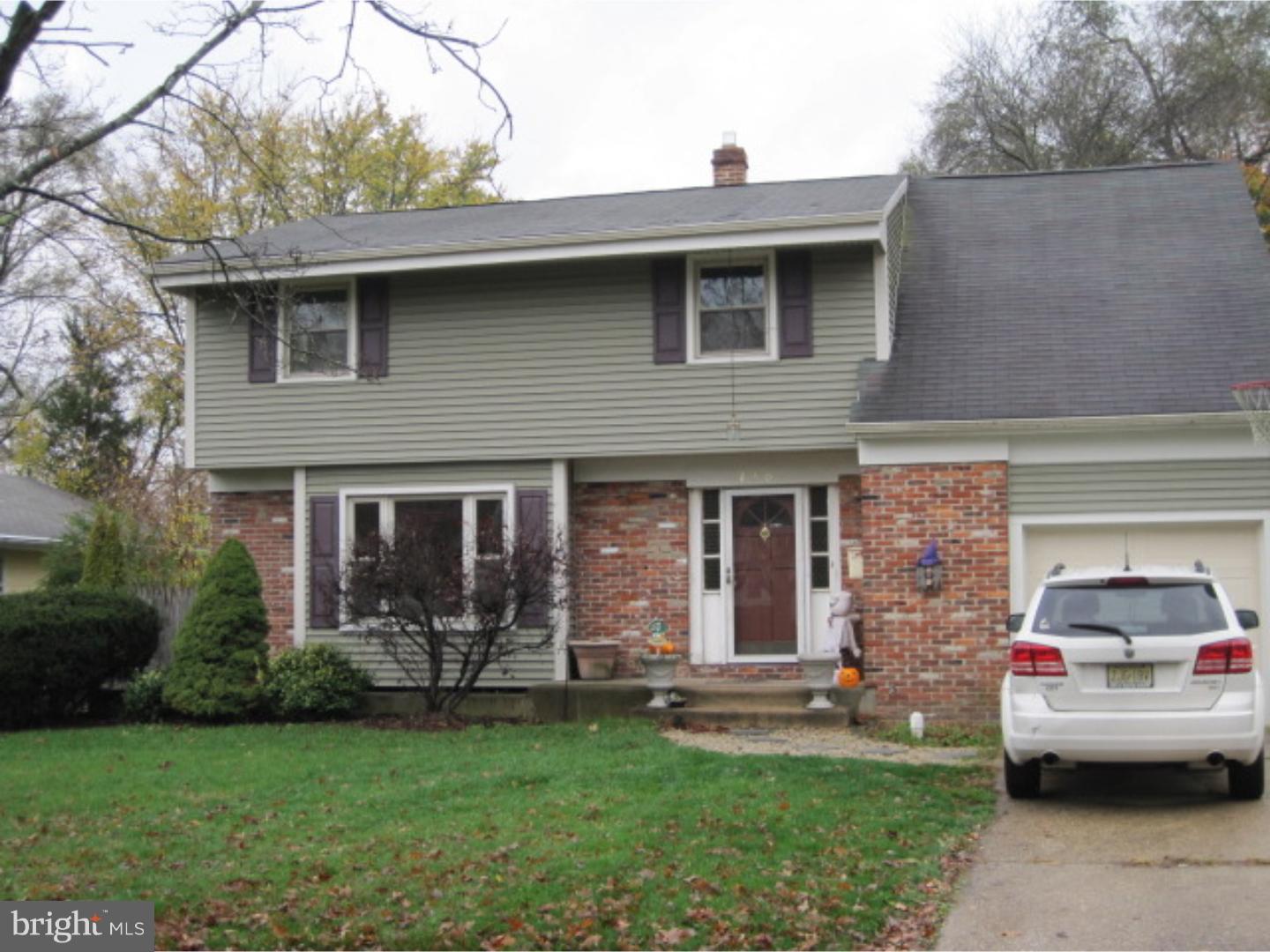 2301 Beverly Road Cinnaminson, NJ 08077 - Photo 2 of 3 a front view of a house with a garden and plants