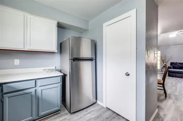 a kitchen with a refrigerator a washer and dryer