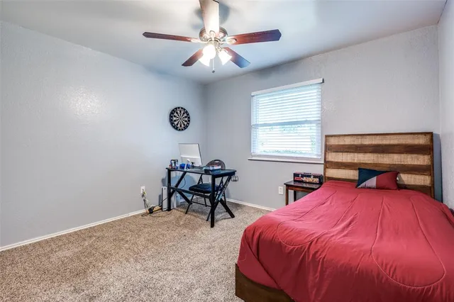 a bedroom with a bed and a table in it