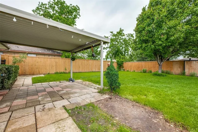 a view of a backyard with a garden
