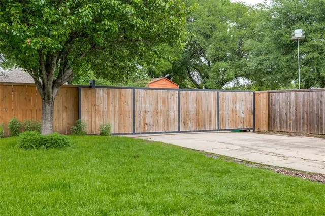a backyard of a house with lots of green space