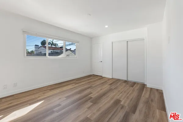 a view of room with window and hardwood floor