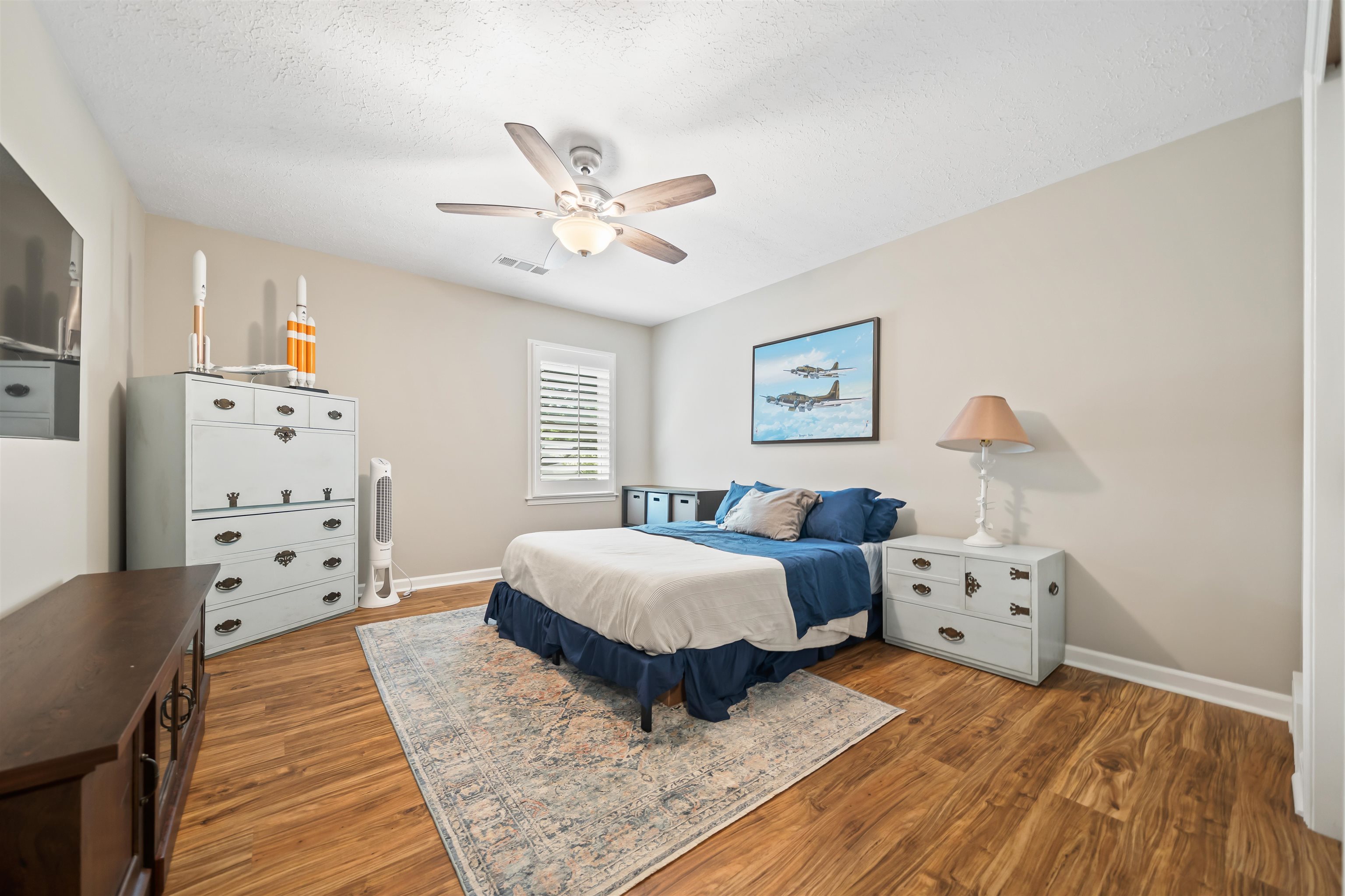 6943 Fords Station Road, Unit 64 Germantown, TN 38138 - Photo 27 of 30 Spacious room featuring wood-finish flooring, a ceiling fan with integrated lighting, and a window with plantation shutters