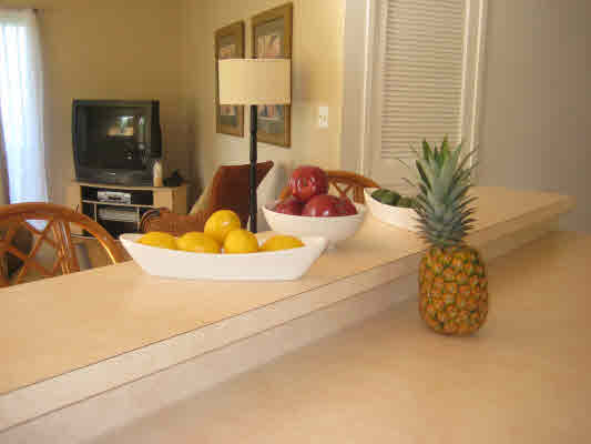3780 Edward Road, Unit 5201 Princeville, HI 96722 - Photo 17 of 23 a view of living room with furniture and a potted plant