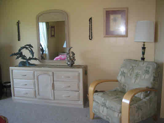 3780 Edward Road, Unit 5201 Princeville, HI 96722 - Photo 20 of 23 a bathroom with a granite countertop sink and a mirror