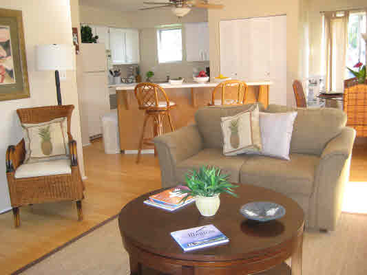 3780 Edward Road, Unit 5201 Princeville, HI 96722 - Photo 10 of 23 a living room with furniture and a table