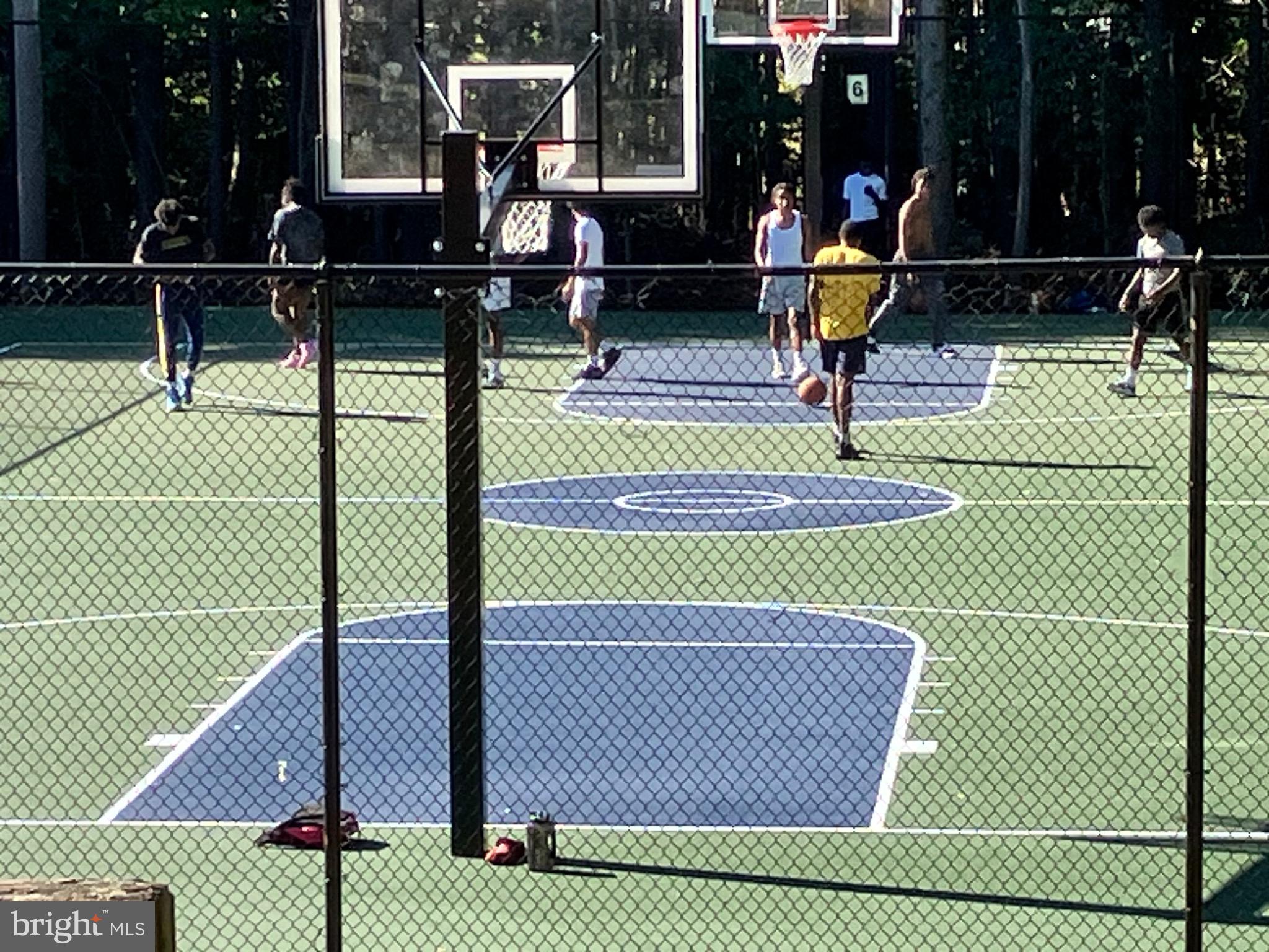 8621 Savannah River Road Laurel, MD 20724 - Photo 33 of 58 Basketball Courts beyond the Pool