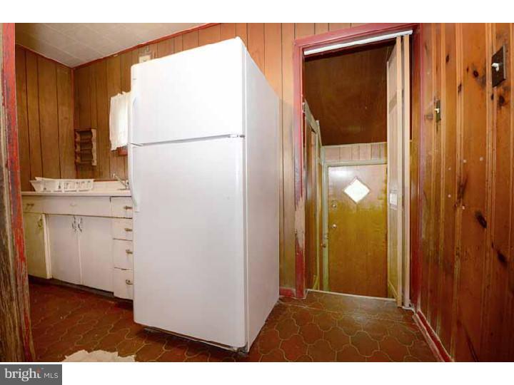 7216 Bradford Road Upper Darby, PA 19082 - Photo 12 of 25 a kitchen with a refrigerator and a stove