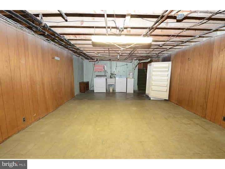7216 Bradford Road Upper Darby, PA 19082 - Photo 14 of 25 a view of a room with wooden walls