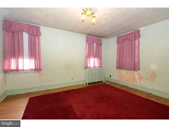 7216 Bradford Road Upper Darby, PA 19082 - Photo 19 of 25 a view of an empty room with a window