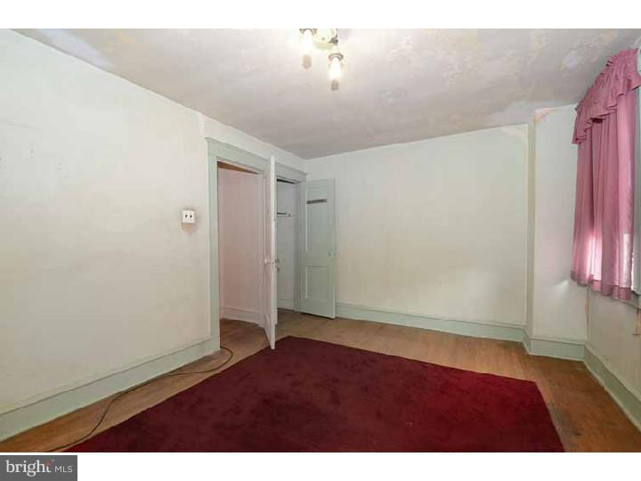7216 Bradford Road Upper Darby, PA 19082 - Photo 20 of 25 an empty room with closet and windows