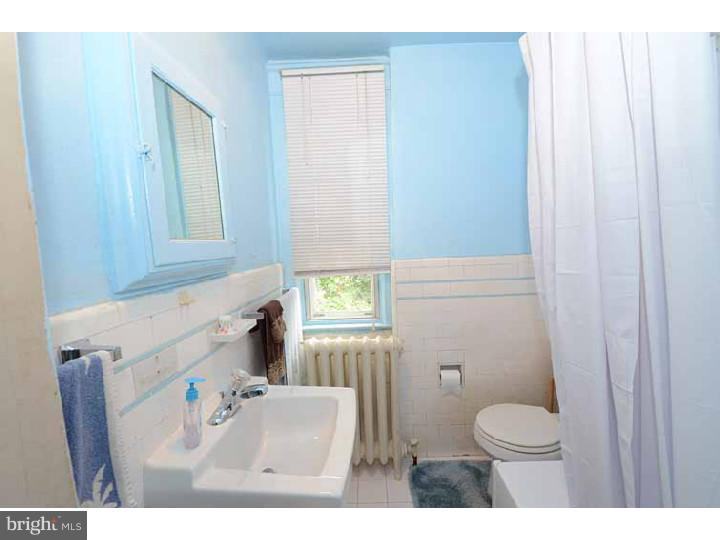 7216 Bradford Road Upper Darby, PA 19082 - Photo 21 of 25 a bathroom with a sink toilet and window
