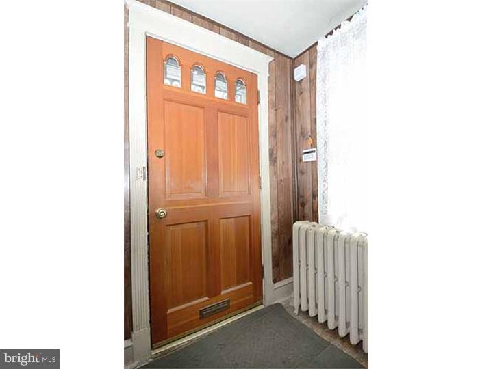 7216 Bradford Road Upper Darby, PA 19082 - Photo 5 of 25 a view of front door with a chair