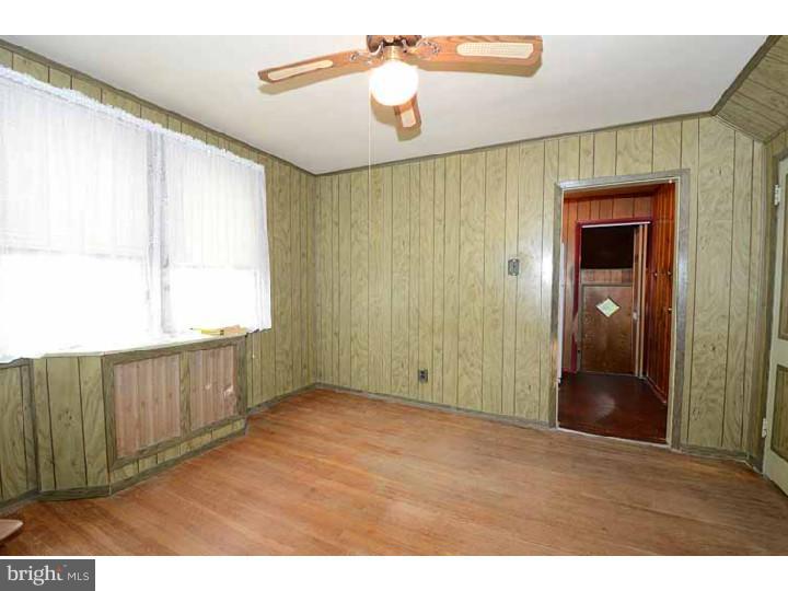 7216 Bradford Road Upper Darby, PA 19082 - Photo 7 of 25 a view of an empty room with wooden floor
