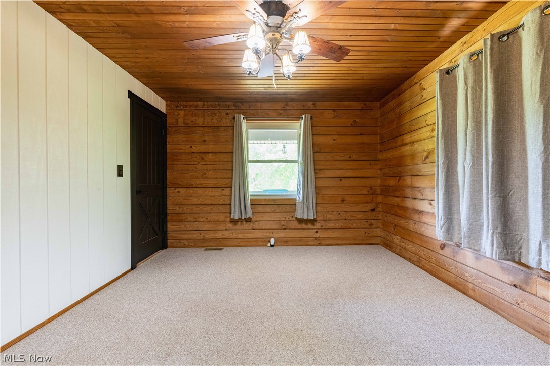 36048 South 16 Road Barnesville, OH 43713 - Photo 22 of 45 Unfurnished room featuring carpet, ceiling fan, and wood ceiling