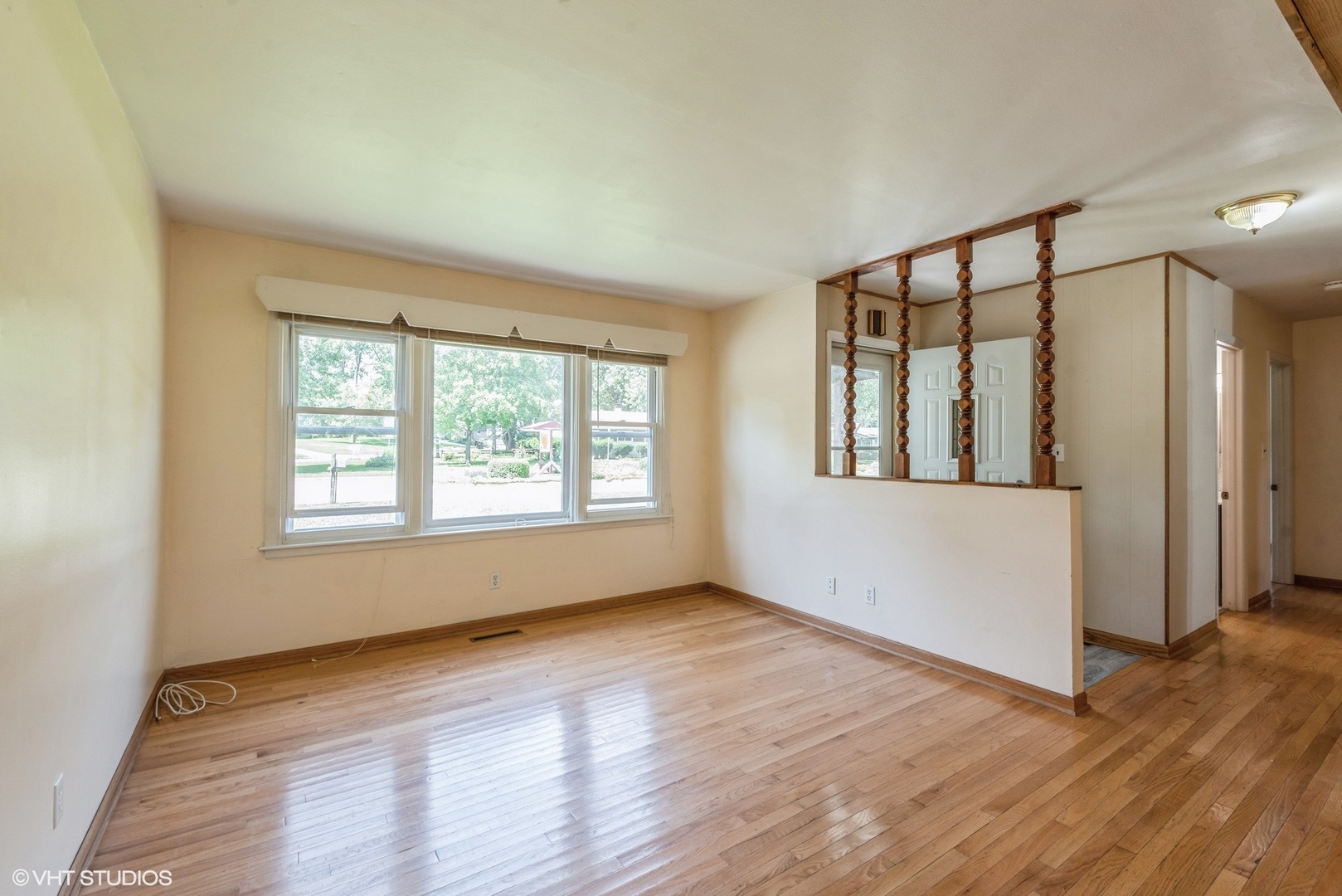2610 Killarney Drive Cary, IL 60013 - Photo 3 of 11 a view of an empty room with wooden floor and a window