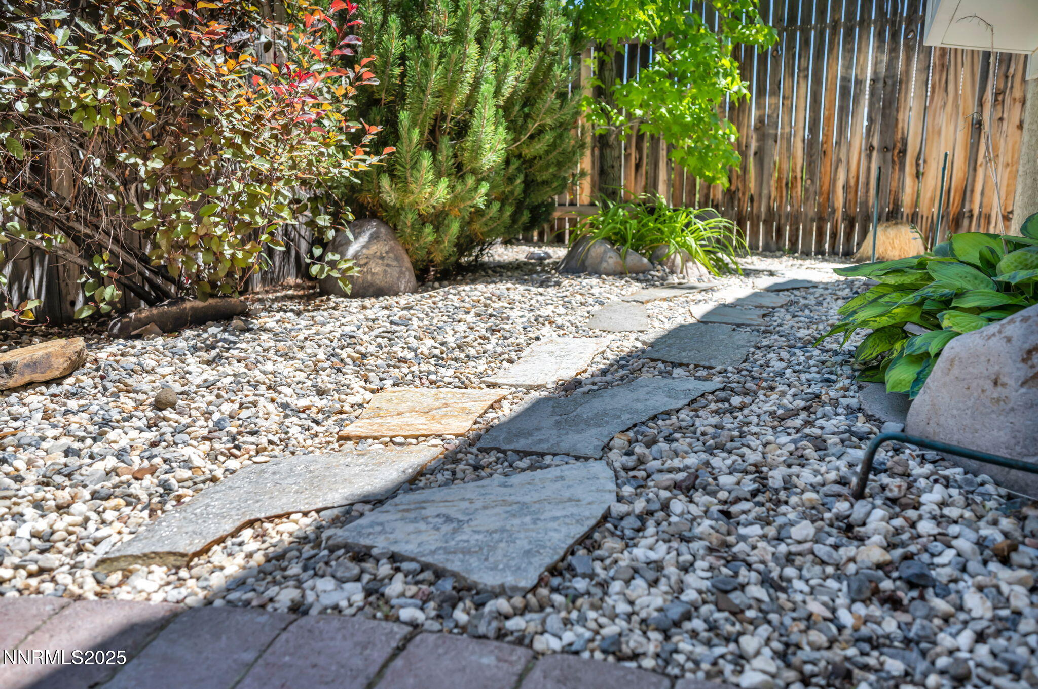 10559 Iron Point Circle Reno, NV 89521 - Photo 28 of 32 a view of a yard with plants and large trees